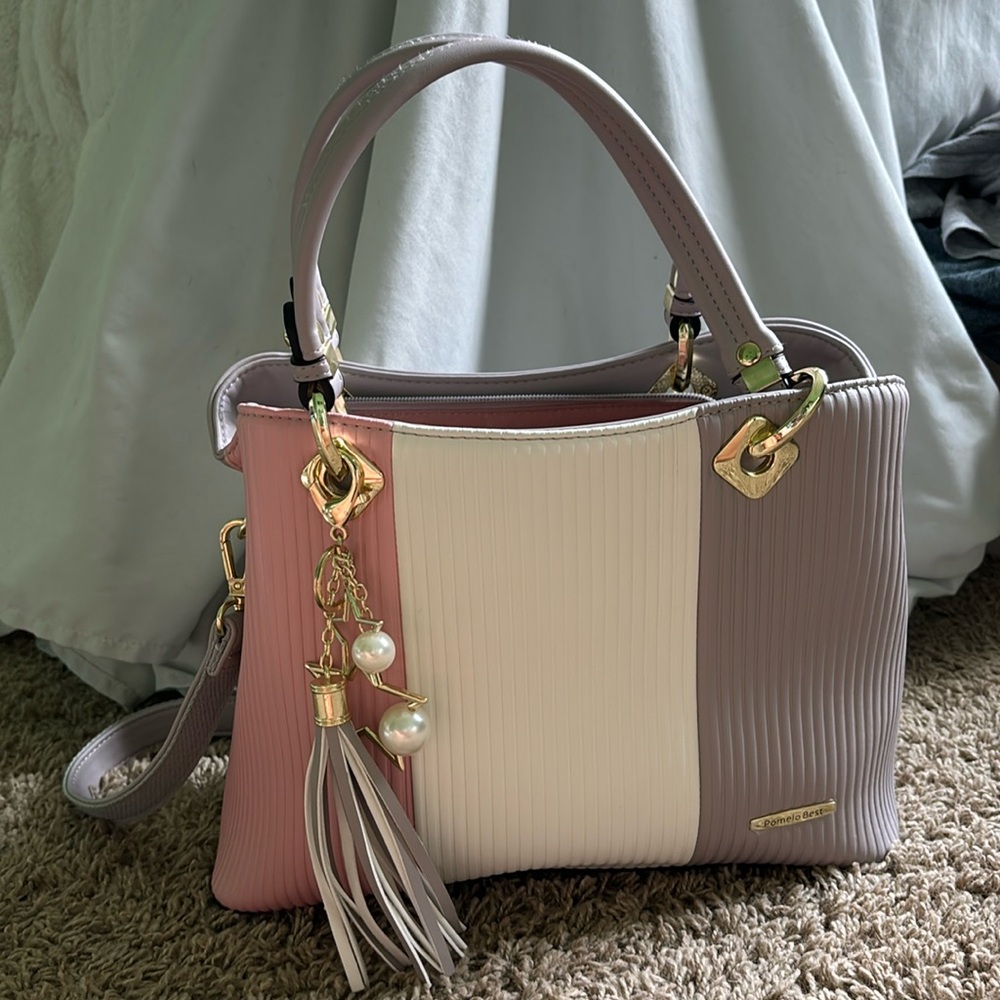 white, gray, and pink spacious purse